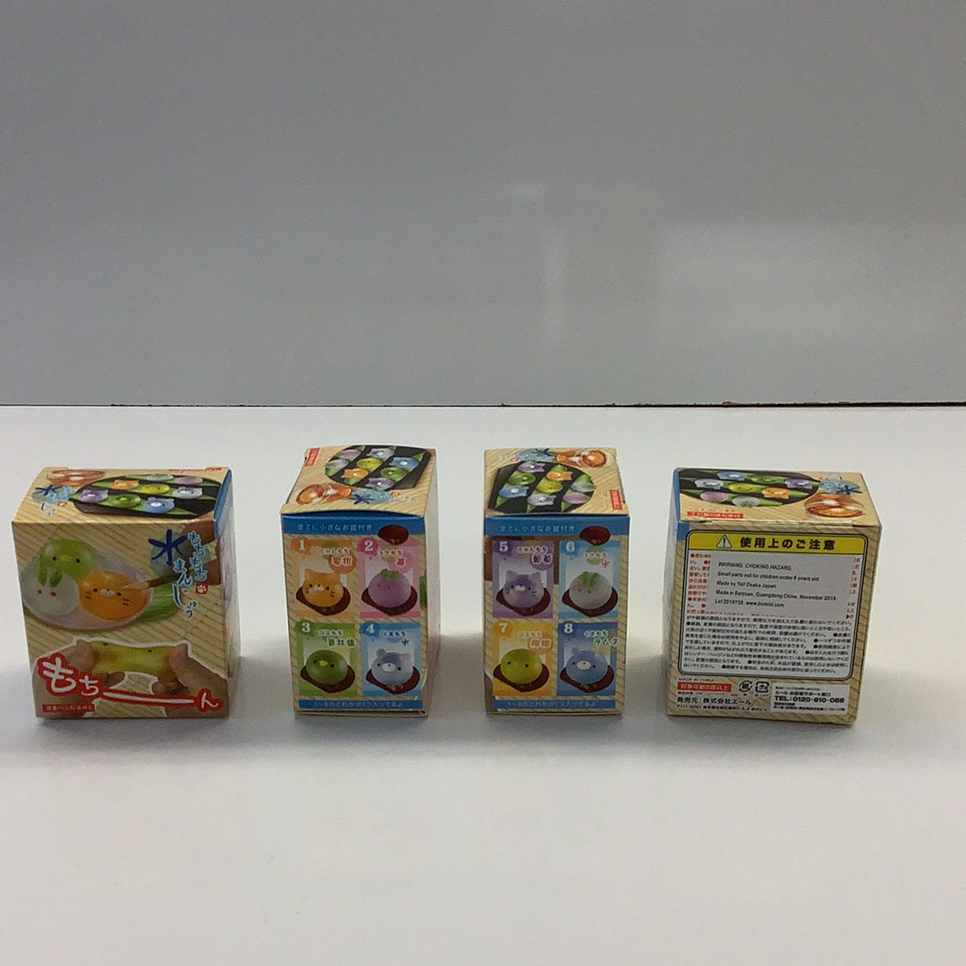 Assortment of gummy animal squishy candies in various packaging boxes for BC USA 62222