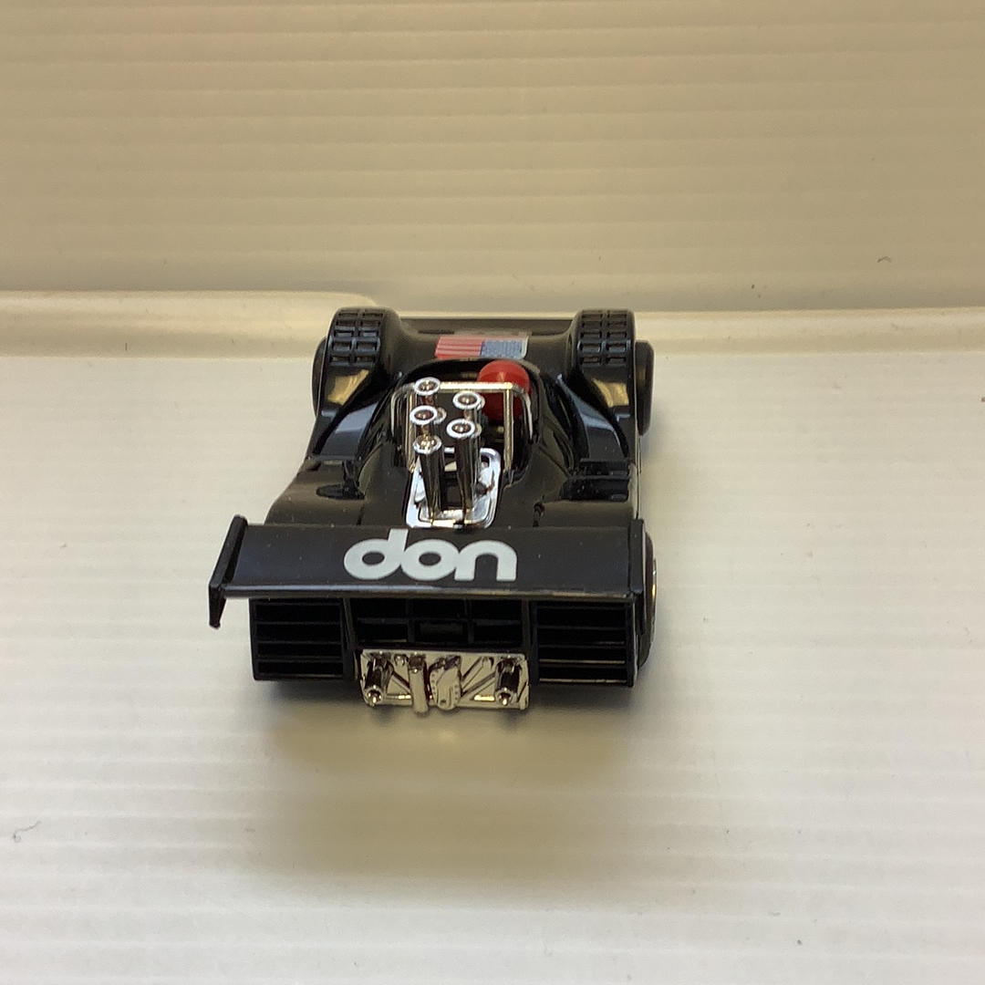 Black model car with "don" logo, viewed from the front for REH Polistil A.108