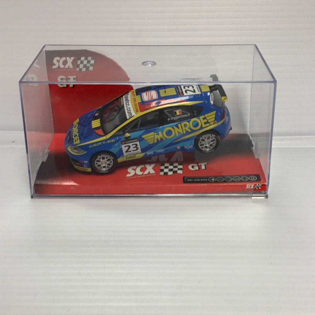 Blue and yellow 1/32 scale slot car of a Seat Leon WTCC race car for SCX 63100