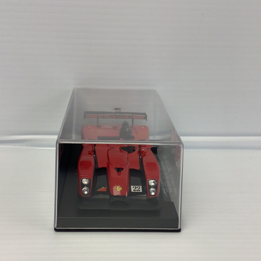 Red race car model in a clear display case for Fly Car 88045