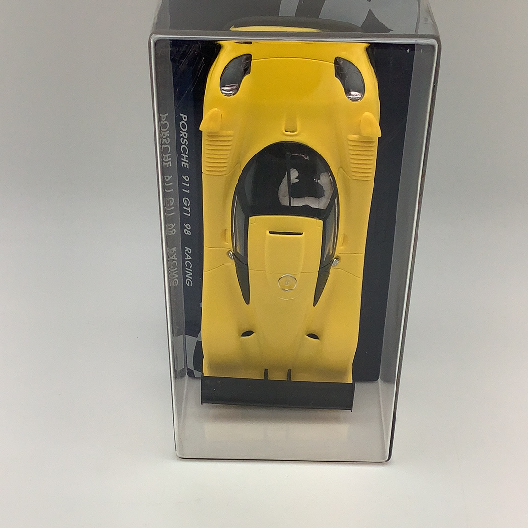 Yellow slot car of a Porsche 911 GT1 98 Racing for Fly Car RG 0a, rear view