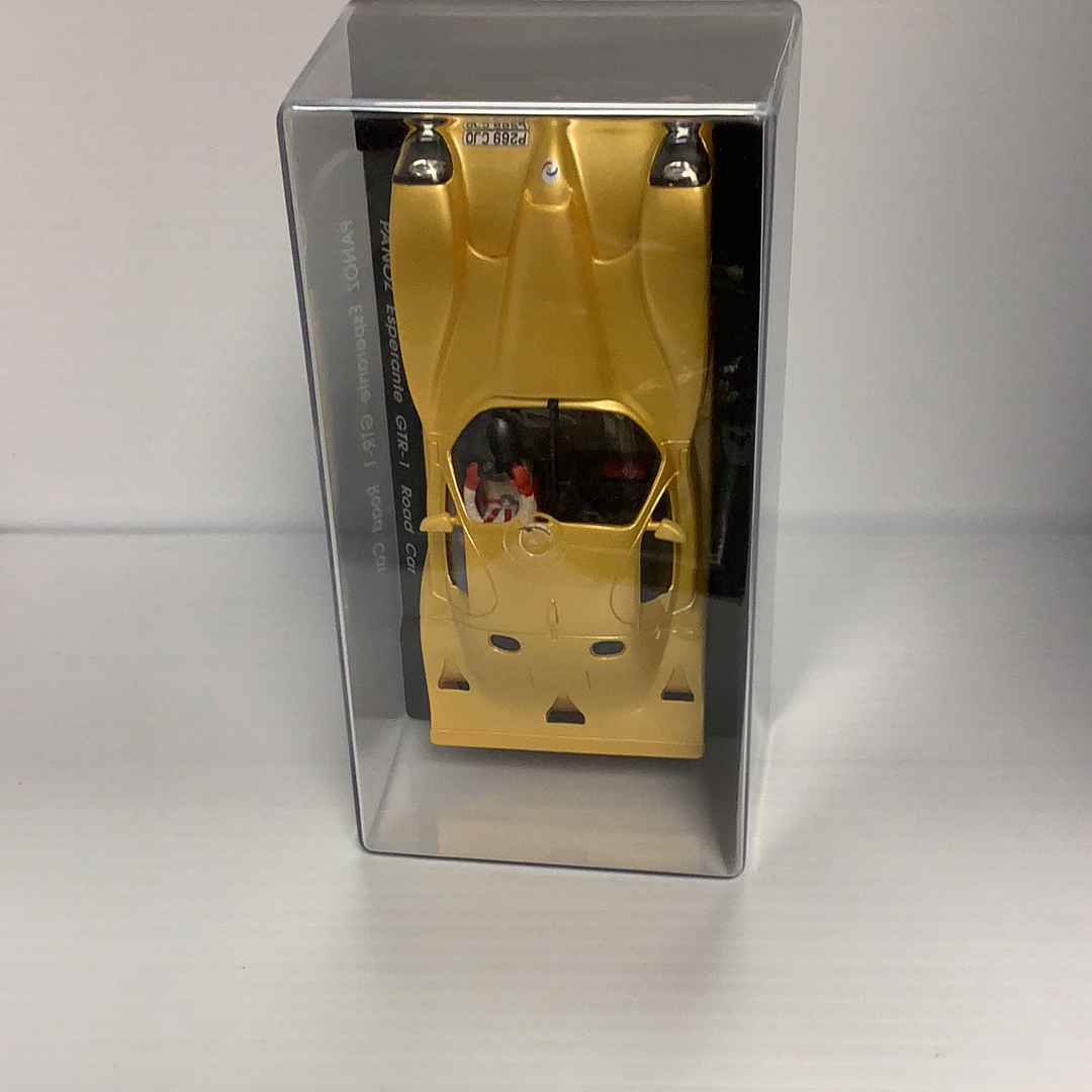 Gold model car in a clear display case for Fly Car A66