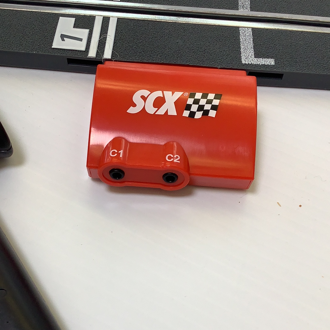 Red throttle control unit with labeled ports C1 and C2 for SCX A4000