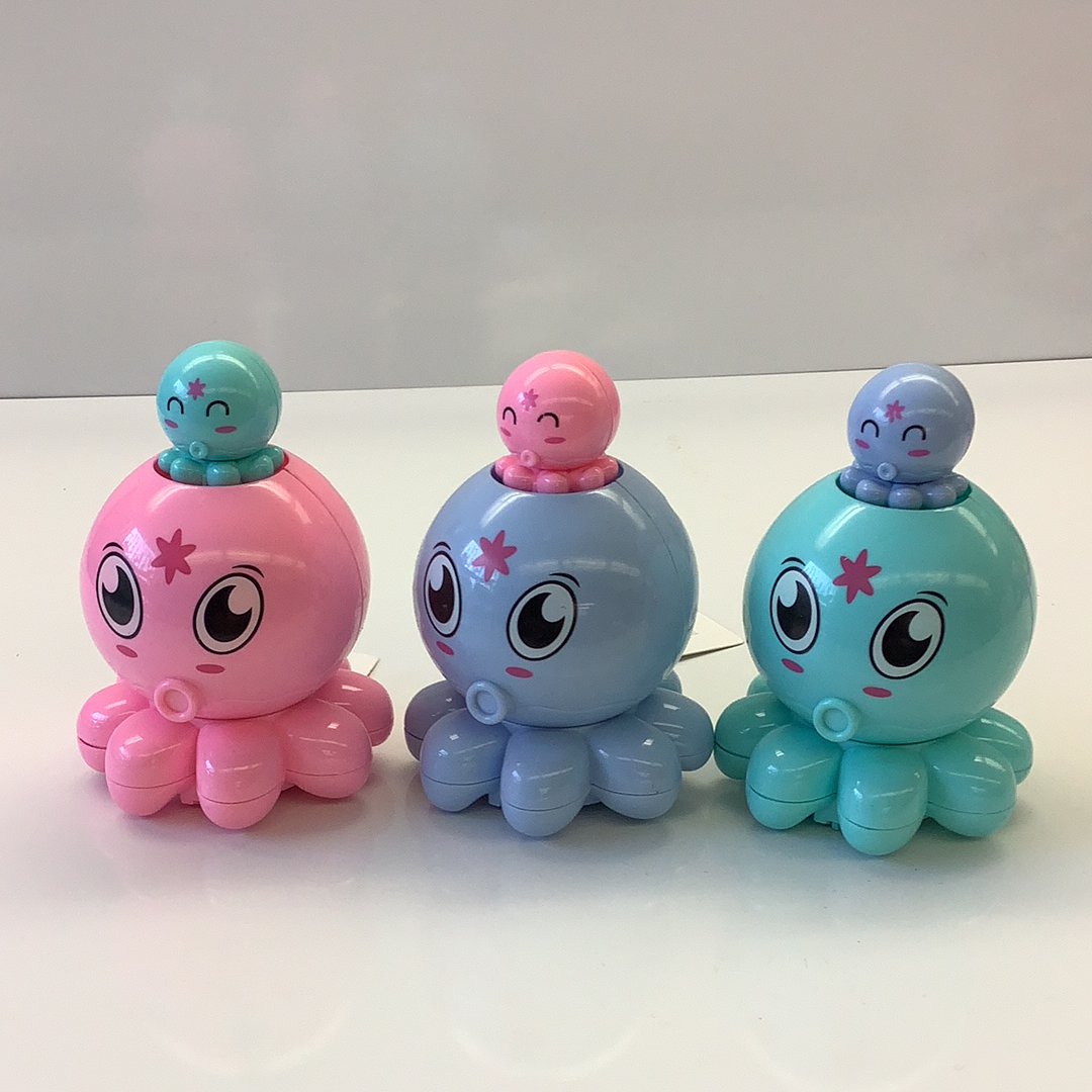Three colorful, push-and-go octopus toys in pink, blue, and teal for Schylling 88509TY, rear view