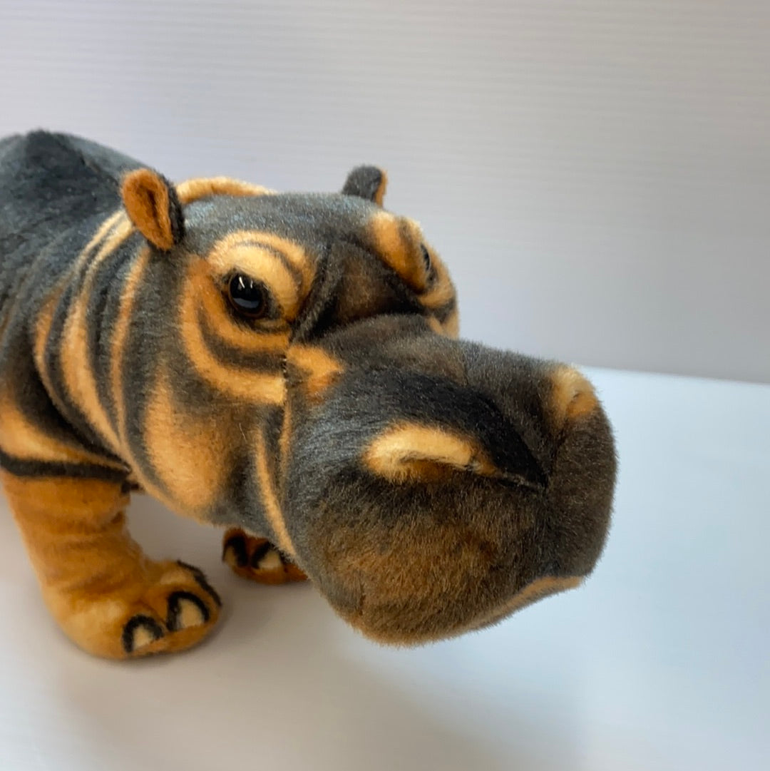 Stuffed hippo toy, brown and gray, resting on a white surface for Real Planet HP38D