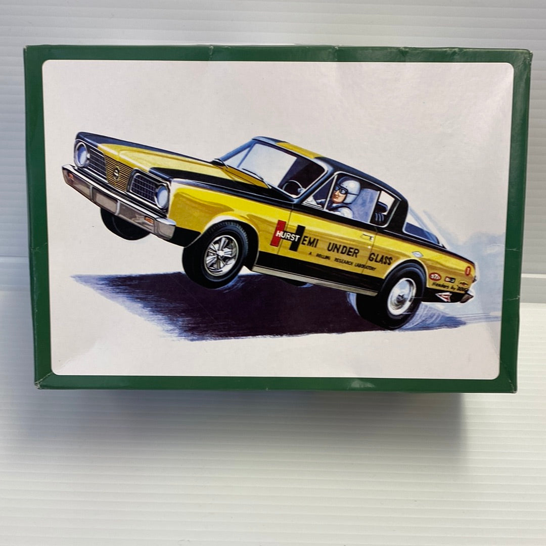 Yellow and black drag car model with driver, displayed in a box for AMT AMT1153