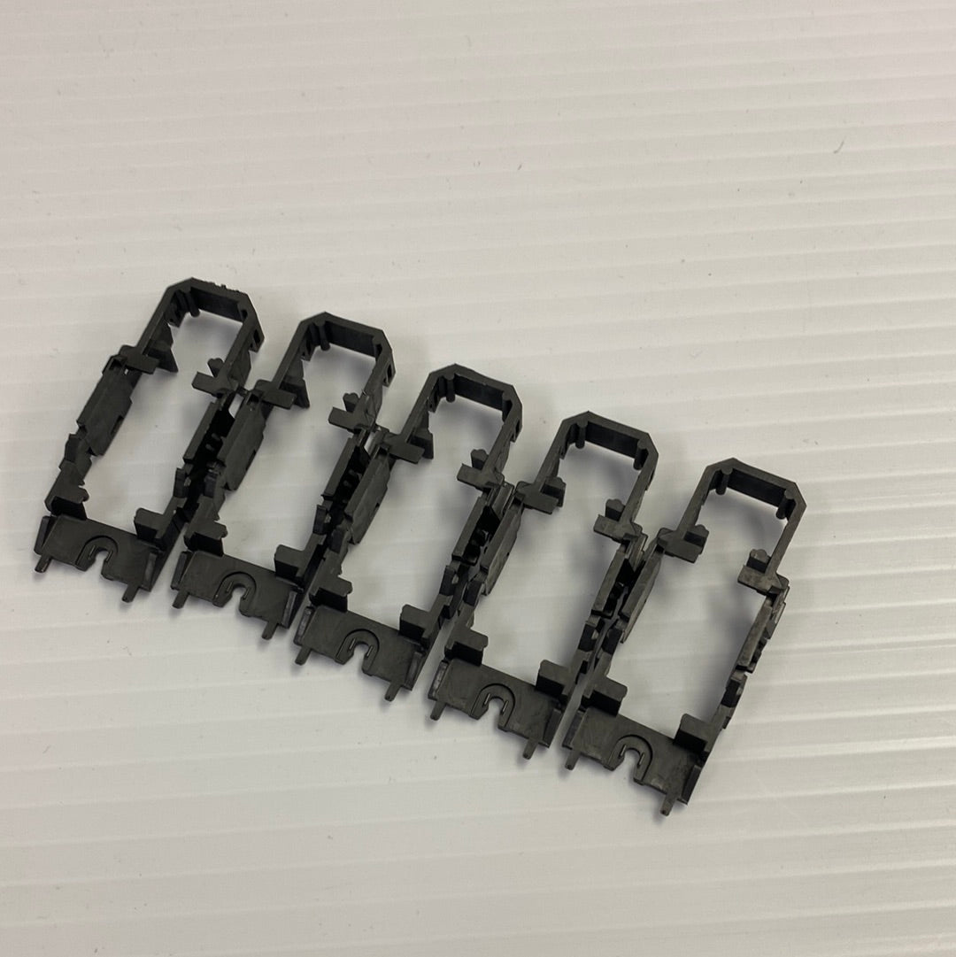 Five black chassis frames for model train track assembly for Tyco H4011