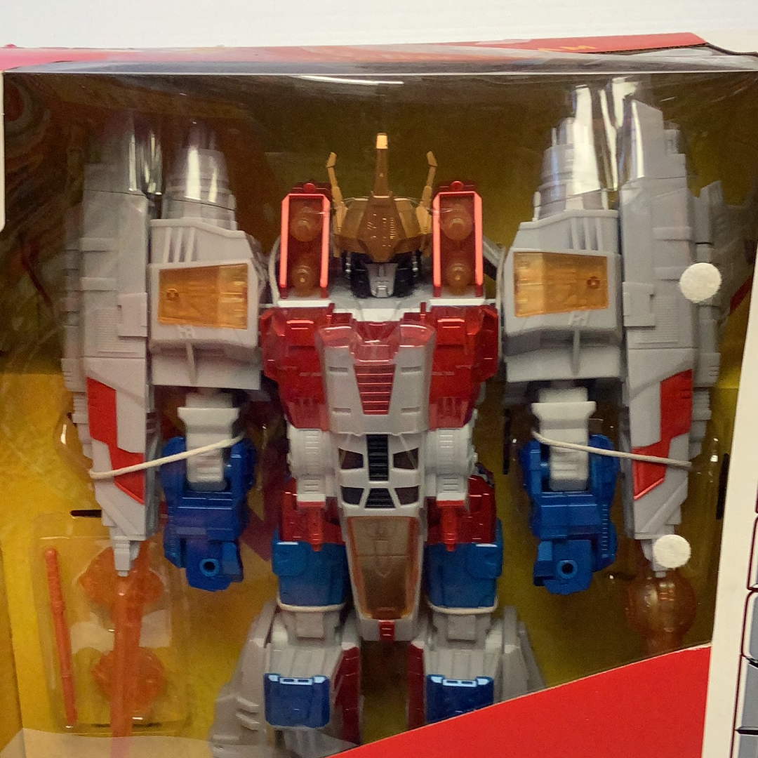 Starscream action figure, red and silver robot toy, displayed in packaging for RJCollection