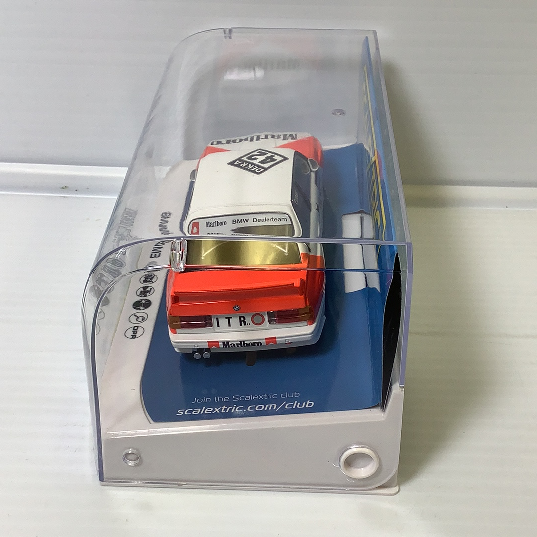 Slot car of a 1991 BMW E30 M3 DTM race car in a clear display case for Scalextric C4168