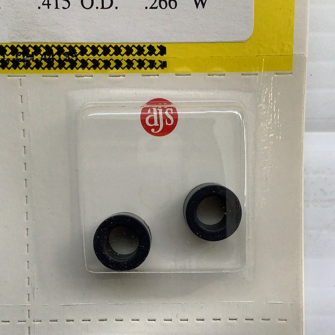 Two black silicone tire rings packaged in a clear plastic blister card for HO Tires Silicone Fits C and D Black Tires 010
