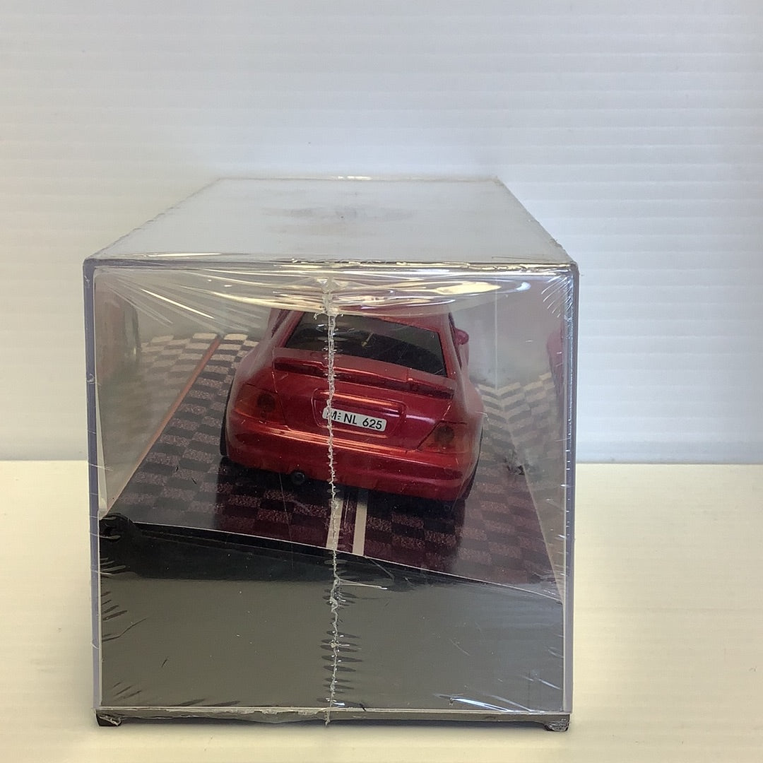 Red Hyundai Accent model car in clear acrylic display case for CARTRIX 0312E
