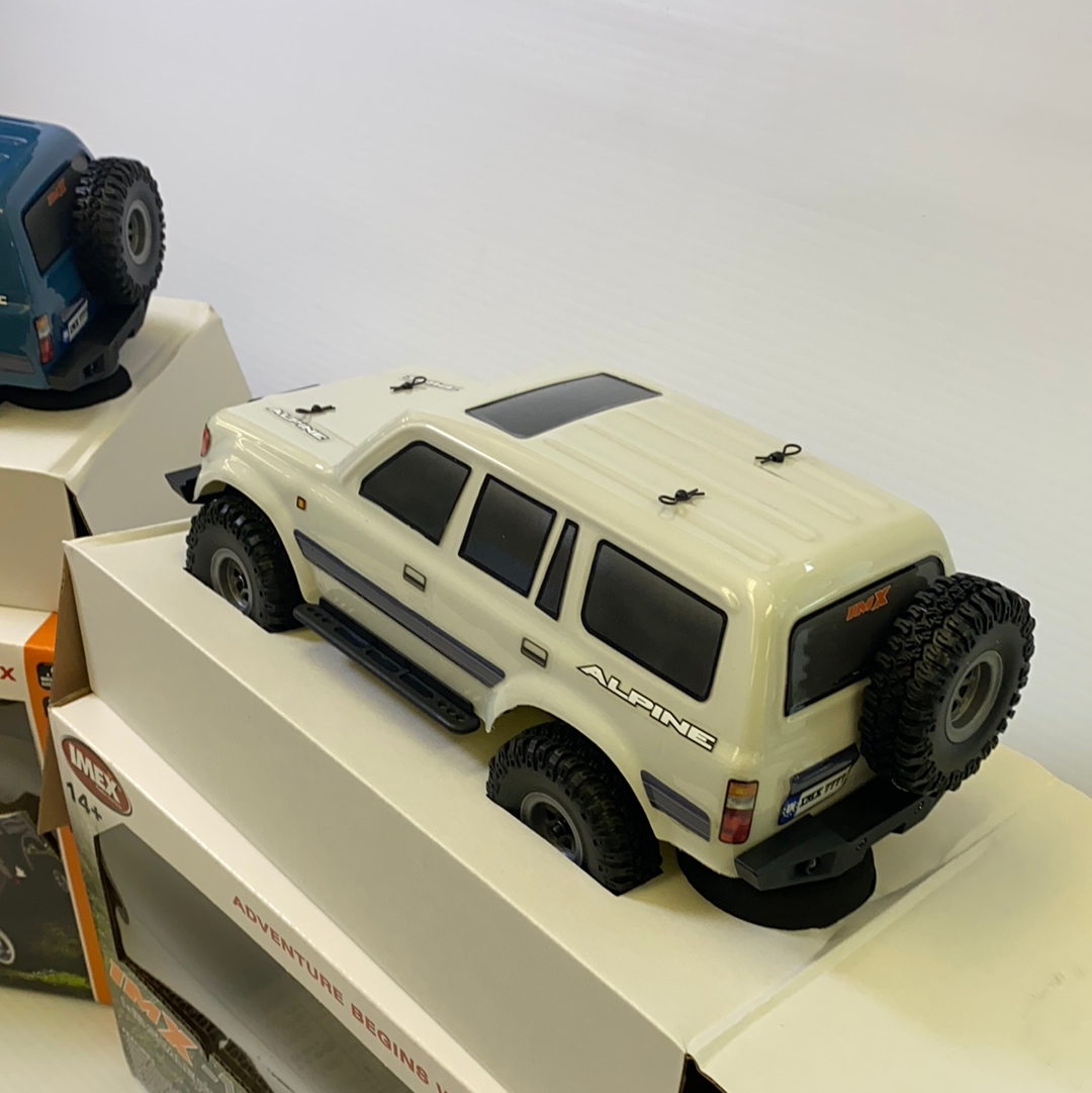 White scale crawler with black trim and off-road tires for IMX IMX25020