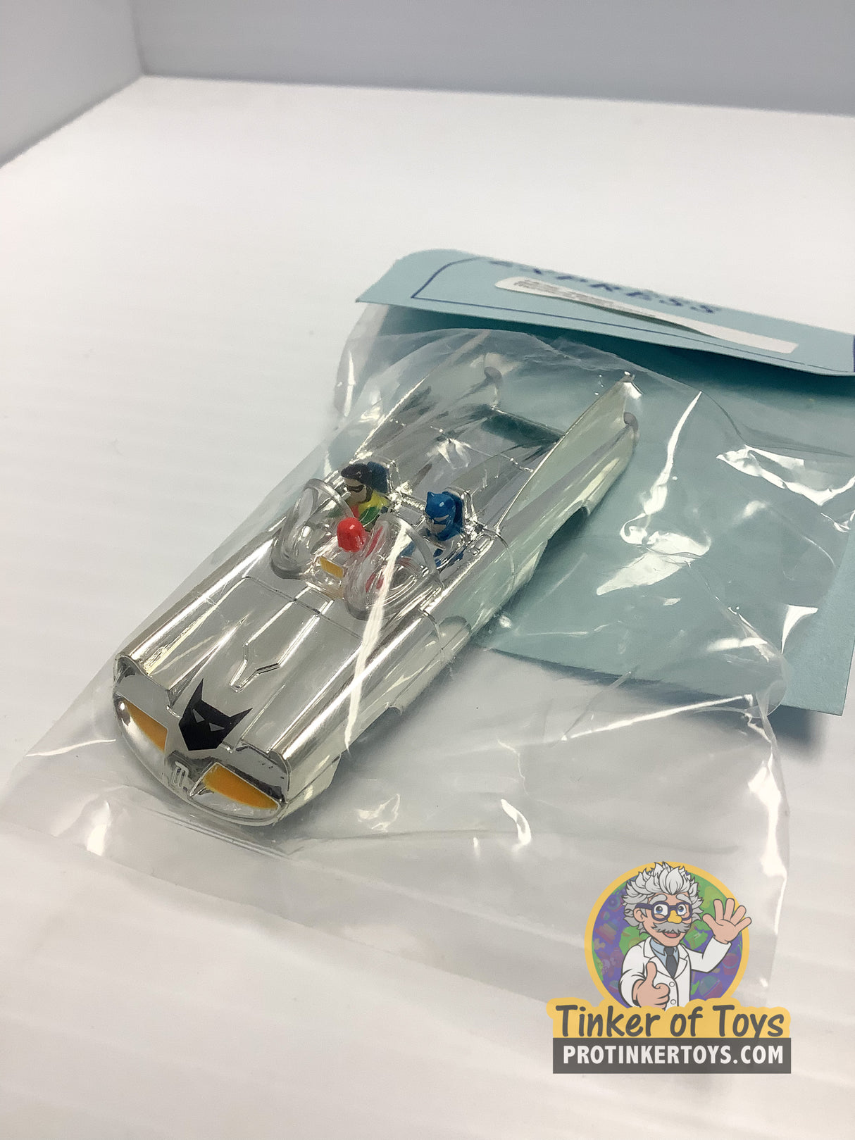 Silver chrome Batmobile toy car in clear plastic packaging for HO Express 4602S