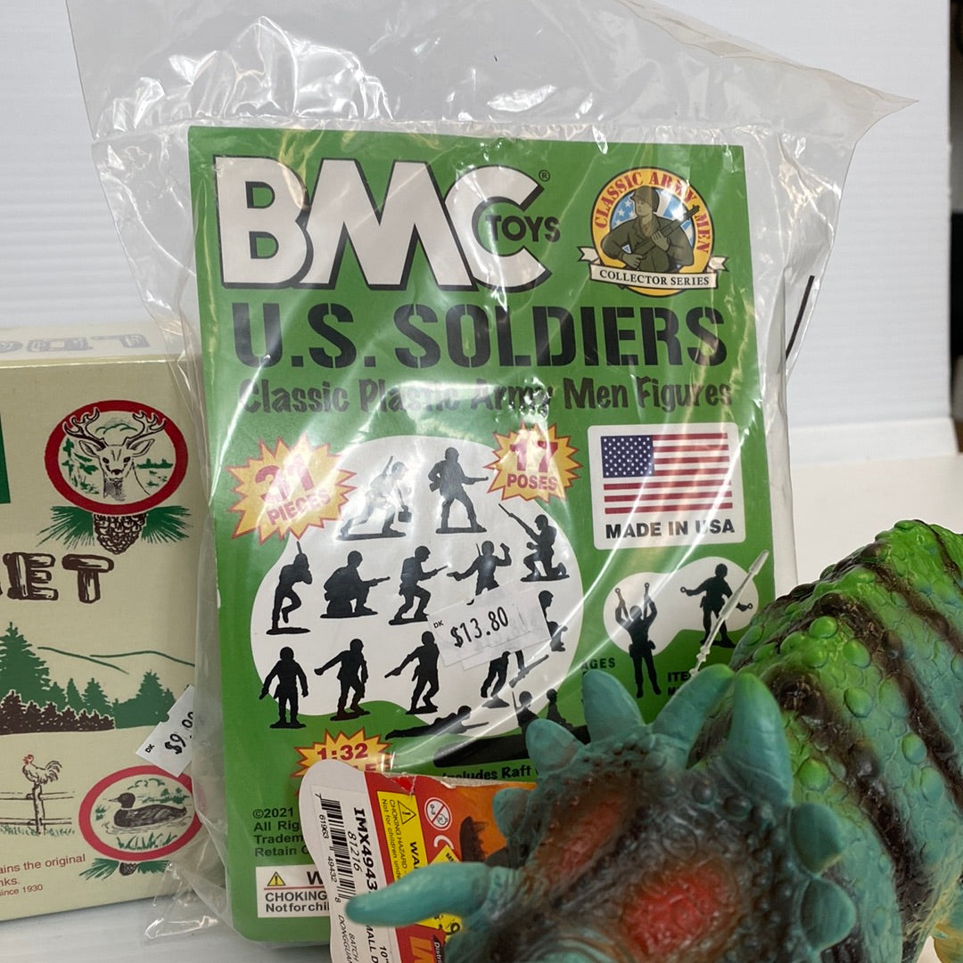 Toy set packaging featuring U.S. Soldiers figures and a dinosaur toy for Schylling