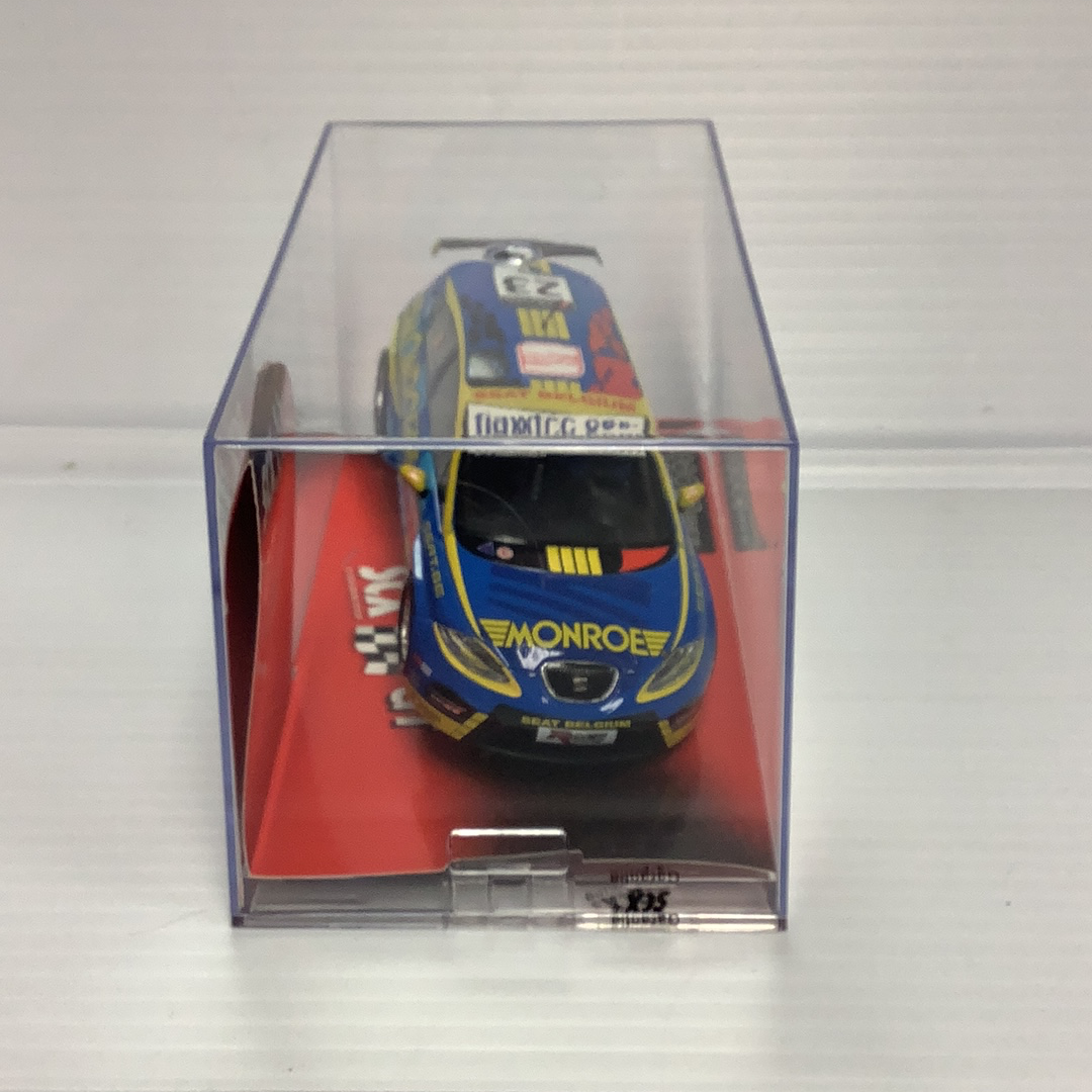 Blue slot car replica of a Seat Leon WTCC race car in clear case for SCX 63100
