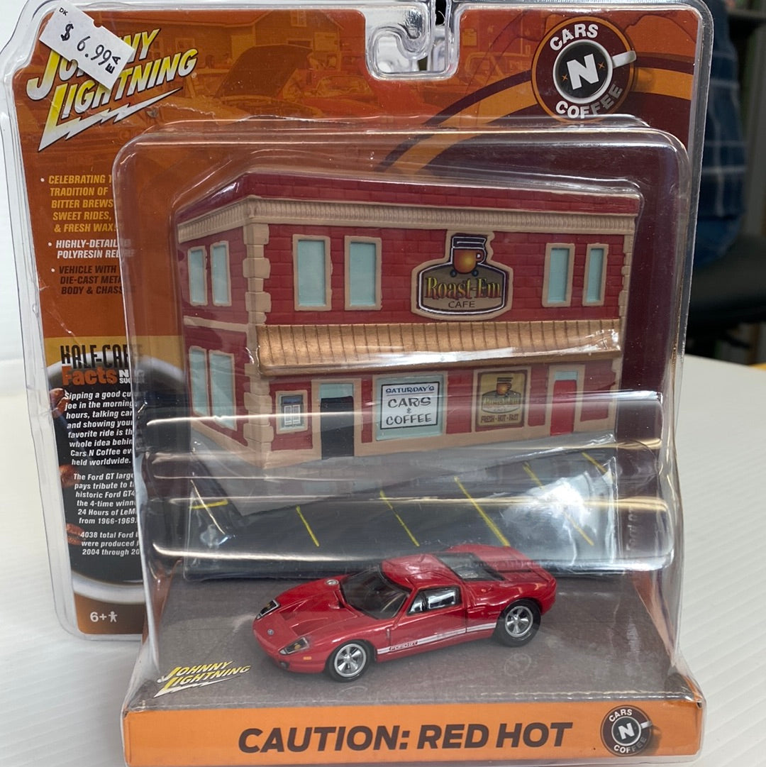 Red 2005 Ford GT die-cast car in a display box for Johnny Lightning JLDR004R