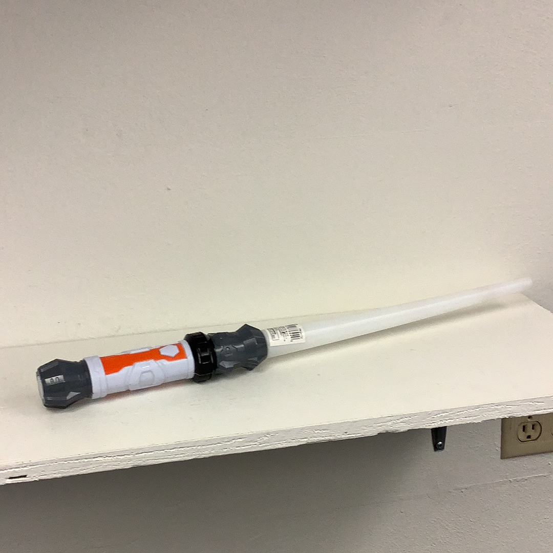 Space saber sword resting on a white shelf with batteries included for Schylling 87644FS