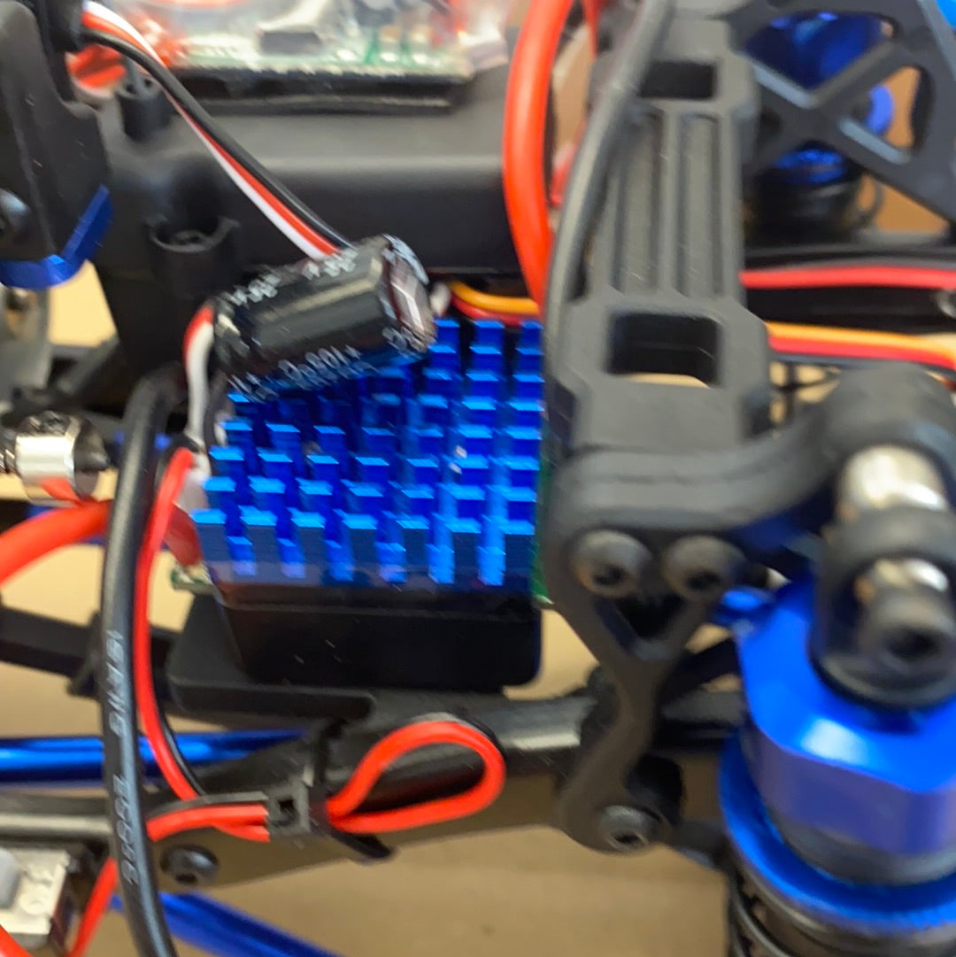 Electric components and blue plastic parts on a crawler truck chassis for IMEX 22020