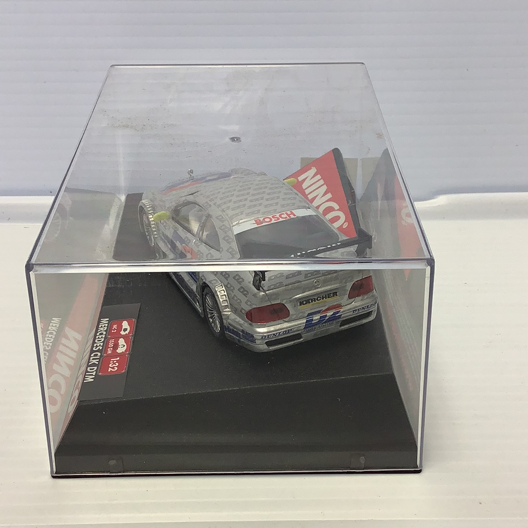Slot car of a Mercedes CLK DTM race car in a clear display case for Ninco 50229
