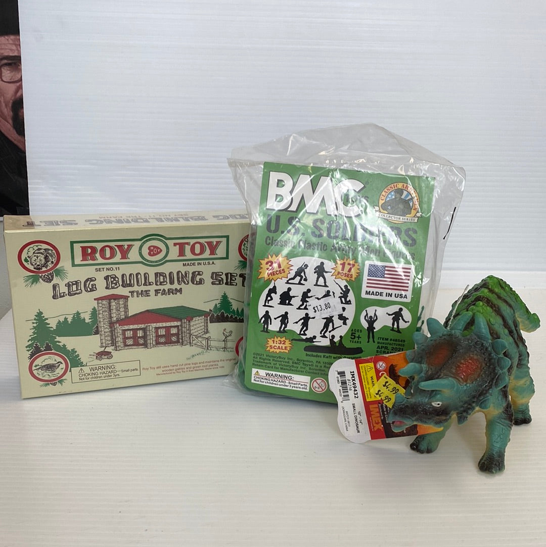 Toy combo: log building set, dinosaur figure, and action figures for Schylling