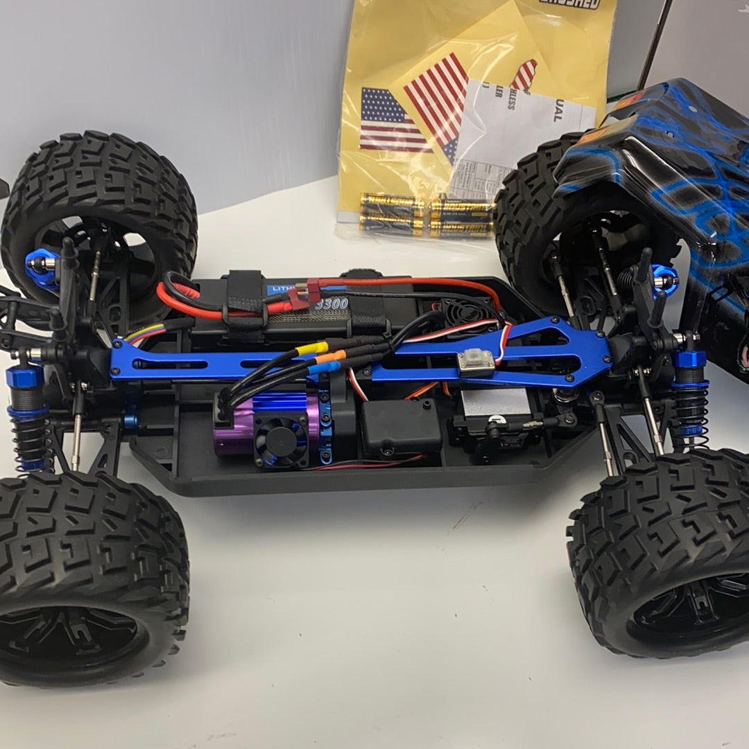 Remote-controlled 1/8 scale truggy with large tires and blue chassis for IMEX 22005