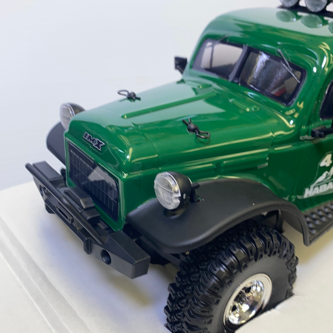 Green crawler toy vehicle with large tires and front lights for IMX IMX25010