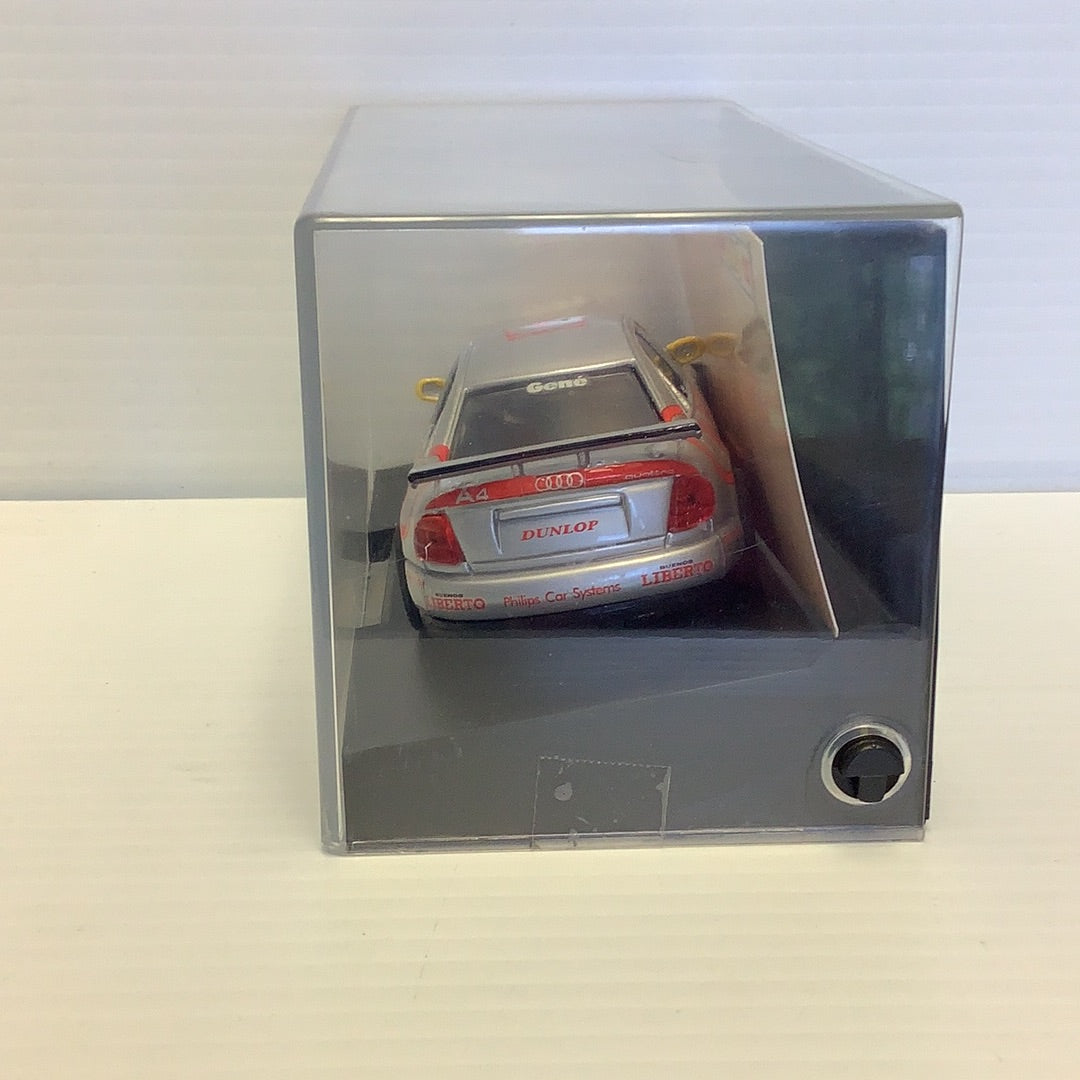 Red Audi A4 model car in a clear display case for Team Slot 10401