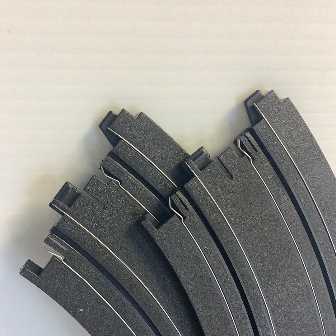 Curved, black metal trim pieces for automotive bodywork for Auto World H0047