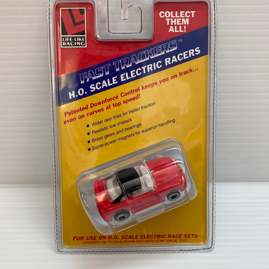 Red Ford Mustang remote-controlled car in clear plastic packaging for Life-Like Racing Max-Traxx 9736