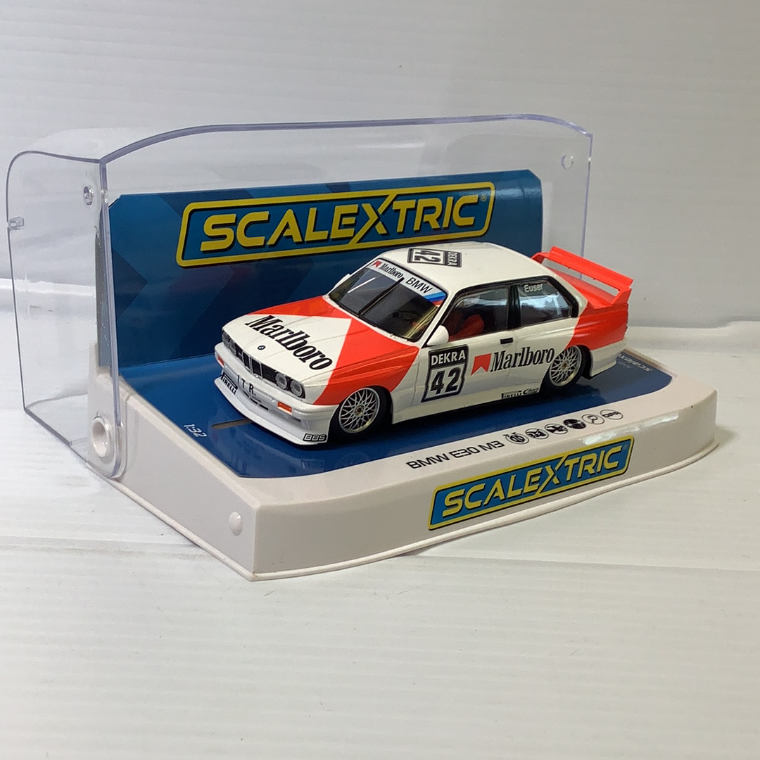 Slot car of a 1991 BMW E30 M3 DTM race car in a display case for Scalextric C4168