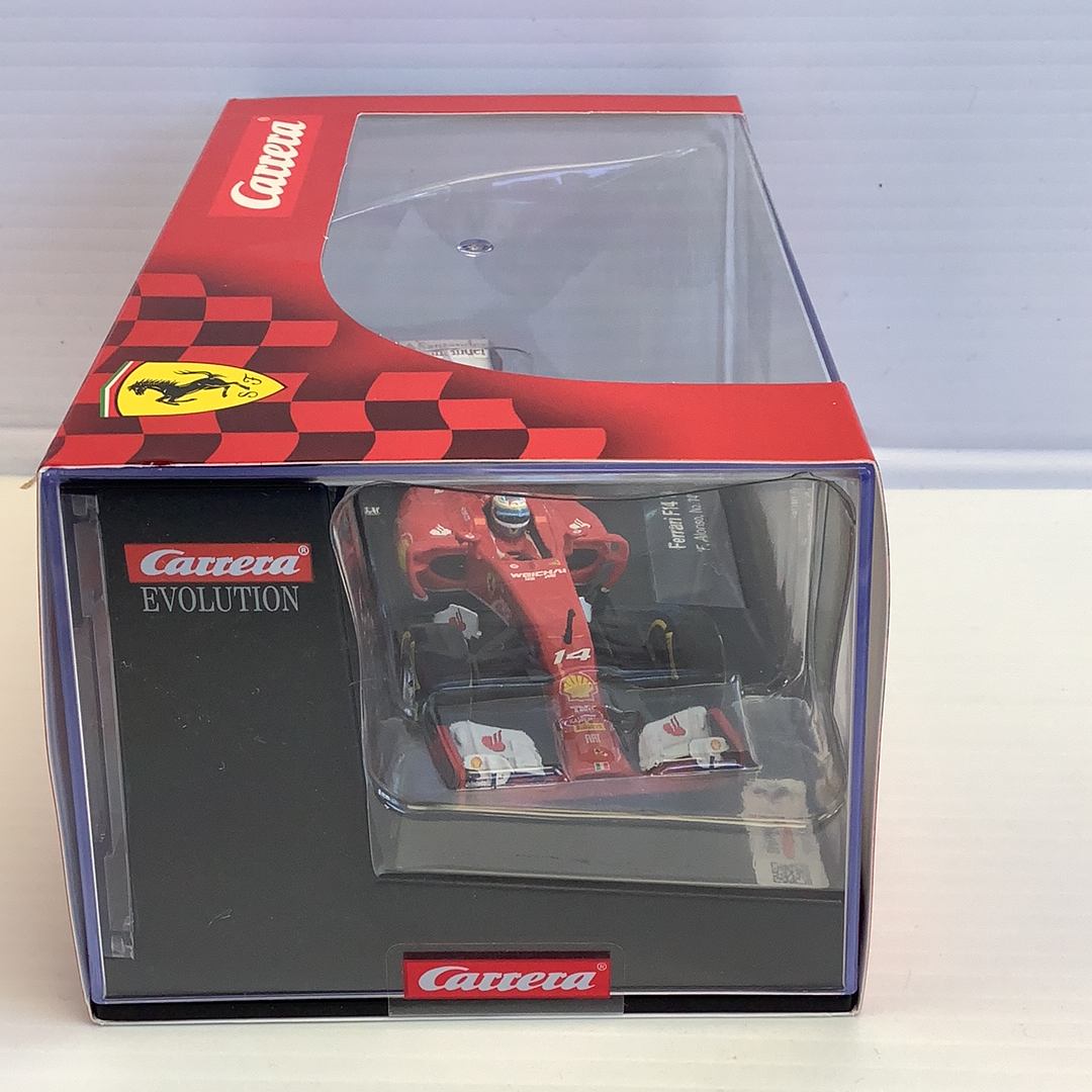 Red Ferrari race car model in box, for collectible display for Carrera Evolution 27496