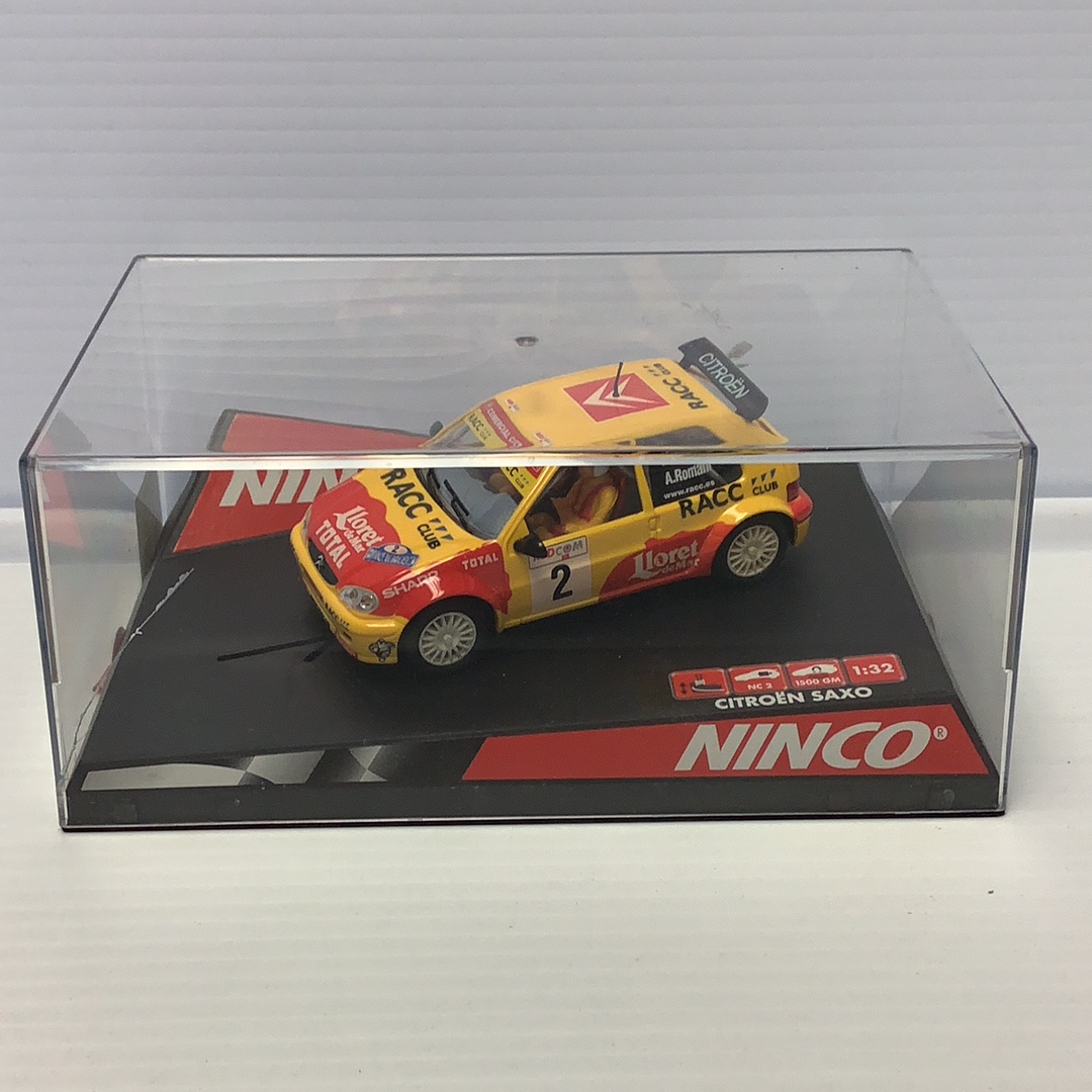 Yellow Citroen Saxo race car model in clear display box for Ninco 50290