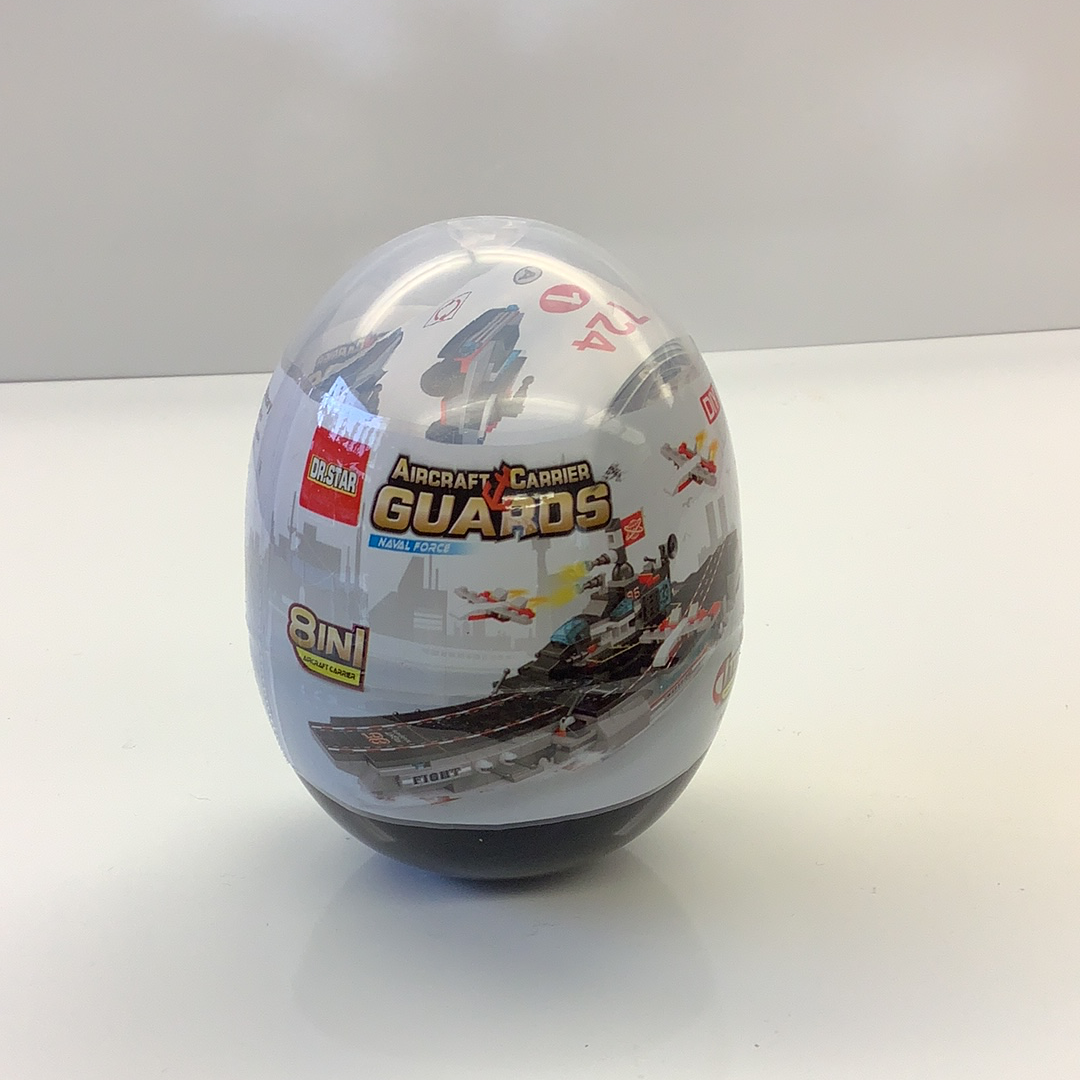 Toy sphere showing an aircraft carrier with action figures and vehicles for Schylling 88240TY