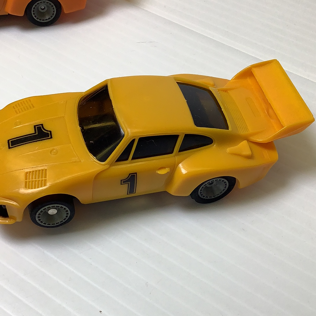 Yellow slot car, open hood, showing the number 1 for Bachmann BAC0002