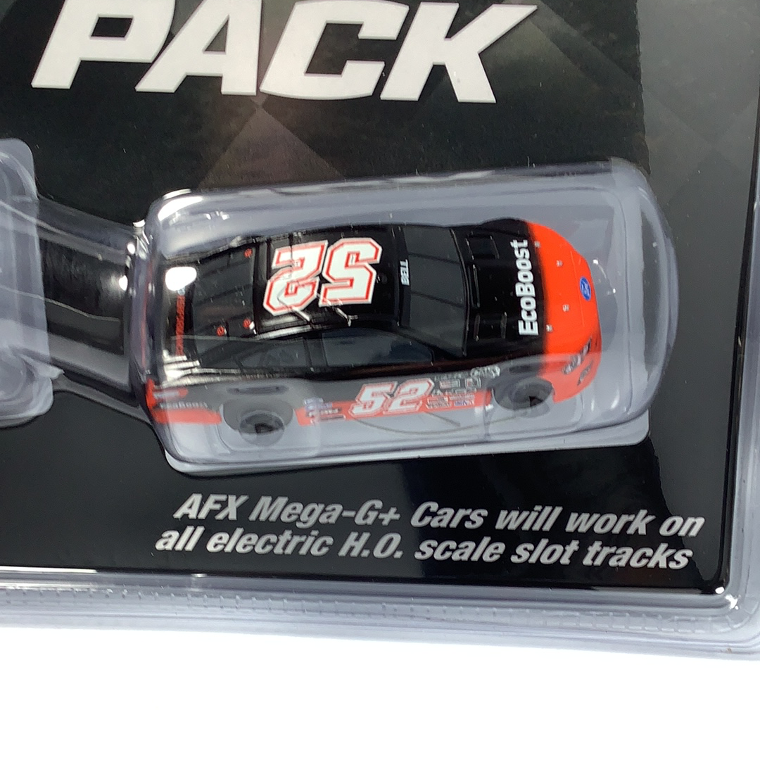 Black and red race car toy in clear plastic packaging for AFX/Racemasters 22041