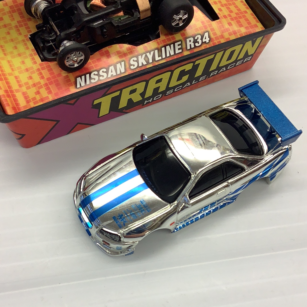 Silver and blue Nissan Skyline R34 slot car toy for Johnny Lightning 39503