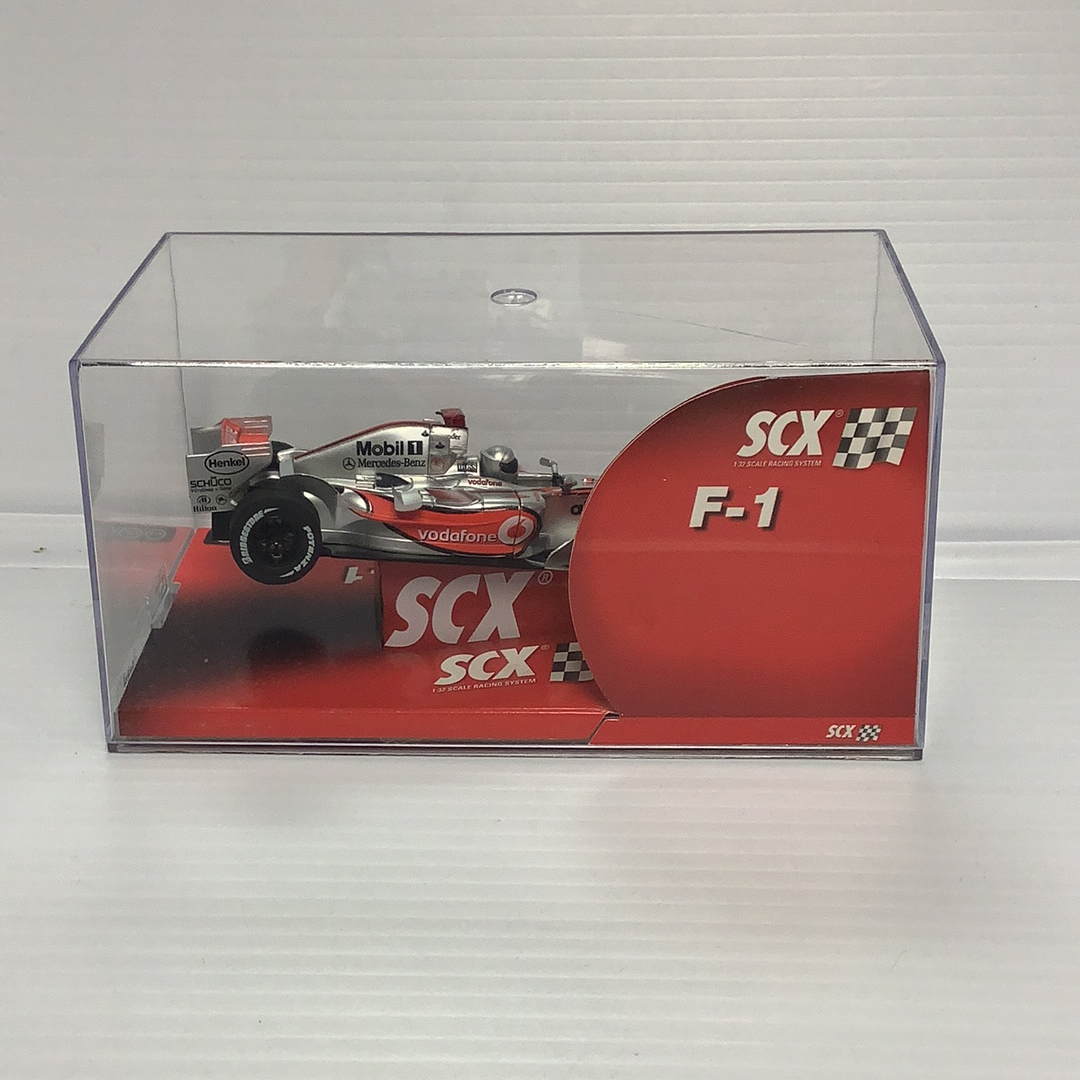 Slot car in case: Vodafone McLaren Mercedes MP4-22 F-1 race car for SCX 62570