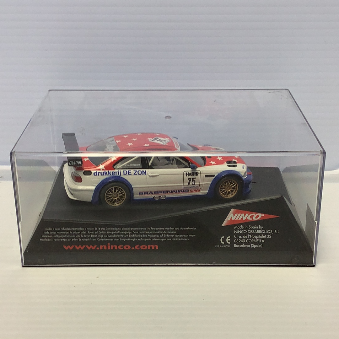Red and white BMW M3 GTR race car toy in clear display case for Ninco 50307