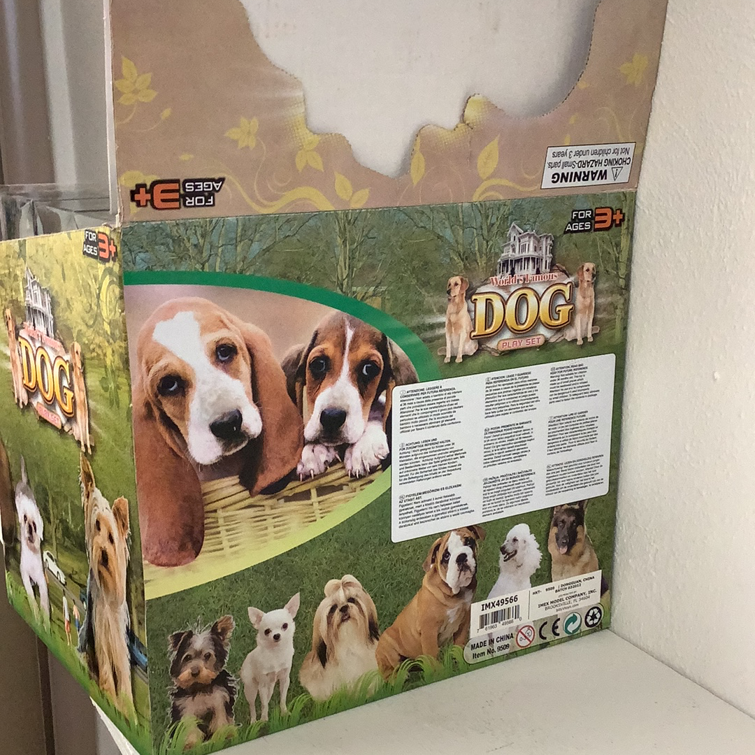 Dog toy set display box showing various dog figures and play accessories for Schylling IMX49566