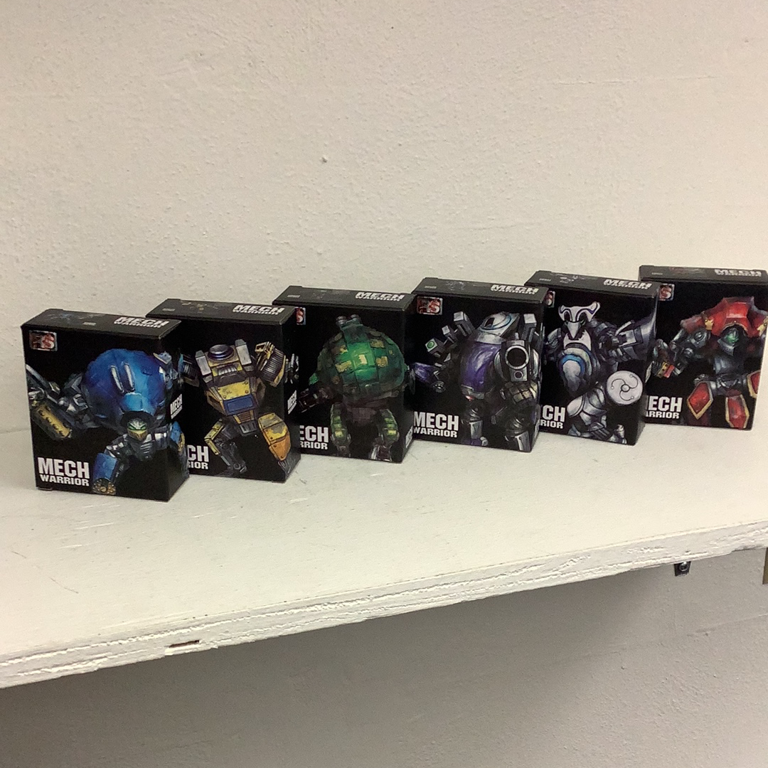 Assortment of boxed mech warrior action figures on a white shelf for Schylling 88392TY