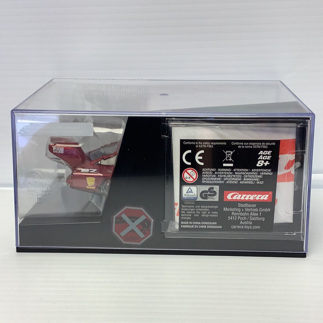 Slot car race car in clear display box with safety warnings for Carrera 27614