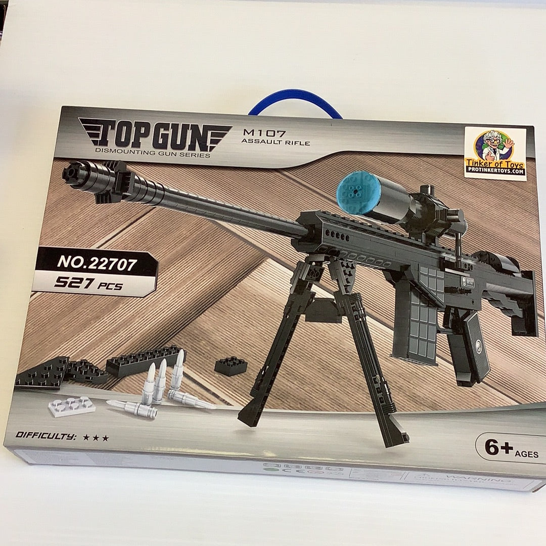 Toy box art for M107 Assault Rifle building set, showing assembled model and parts for Top Gun AUS22707