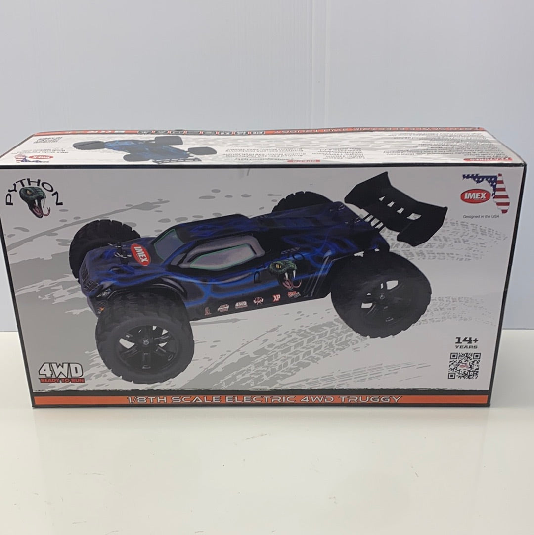Blue 1/8 scale electric 4WD truggy on its box for IMEX 22005