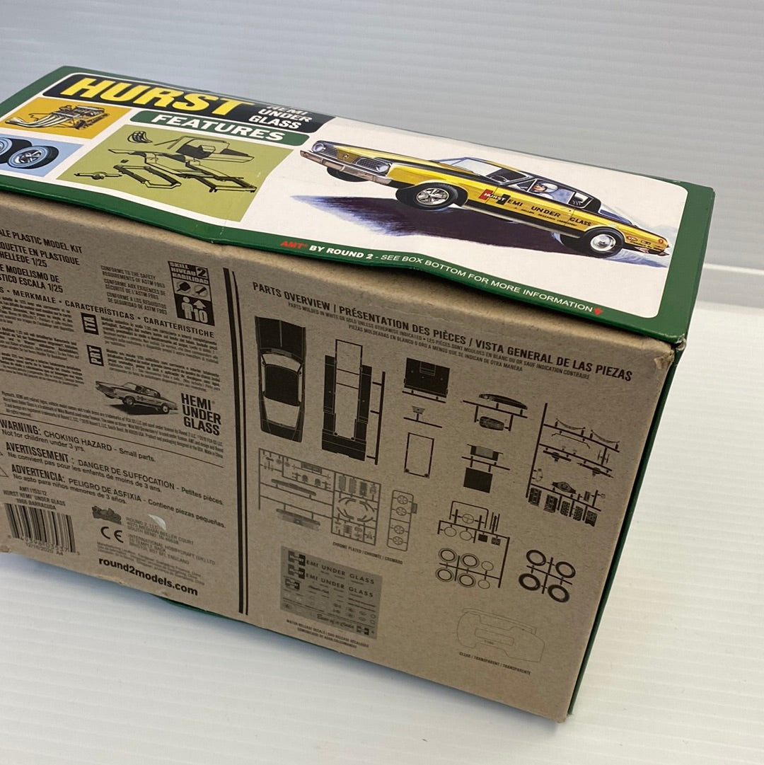 Model kit box art showing a yellow Hurst Funny Car for AMT AMT1153