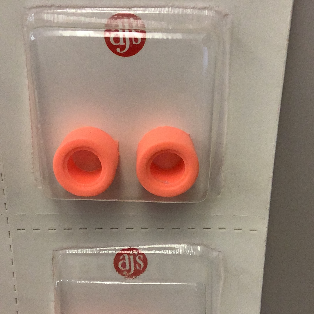 Two bright orange silicone tire rings displayed in a clear plastic packaging for Gum Drops Silicone Day-Glo Orange Tires 018