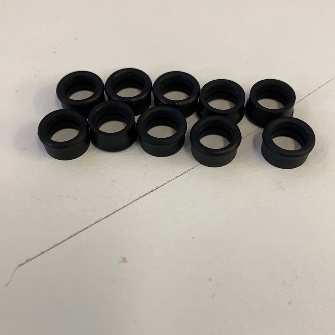 Set of ten black slot car front tires for model cars for Auto World CP7908, front view