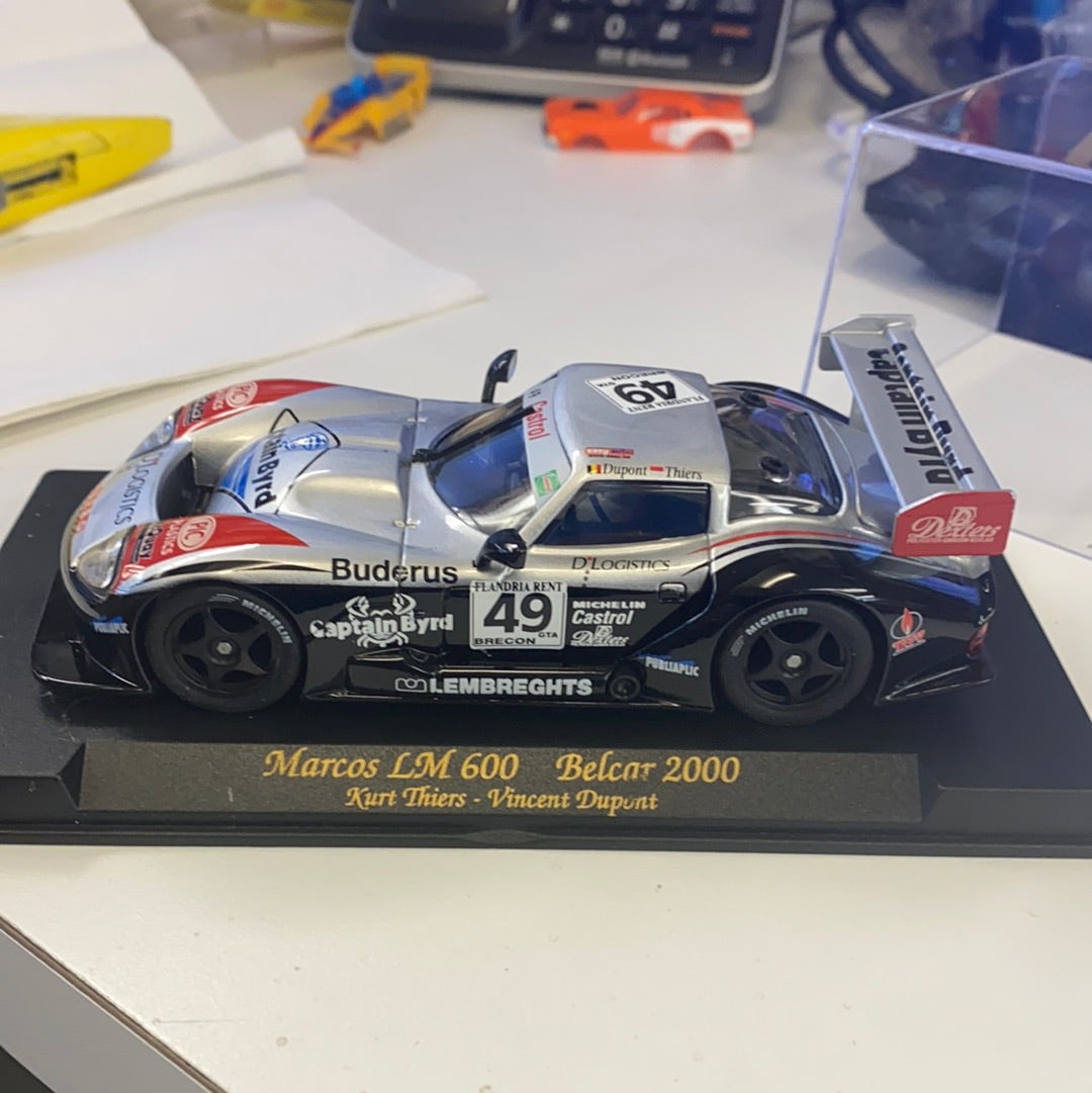 Silver race car model, Marcos LM 600 Belcar 2000, on a display base for Fly Car A29