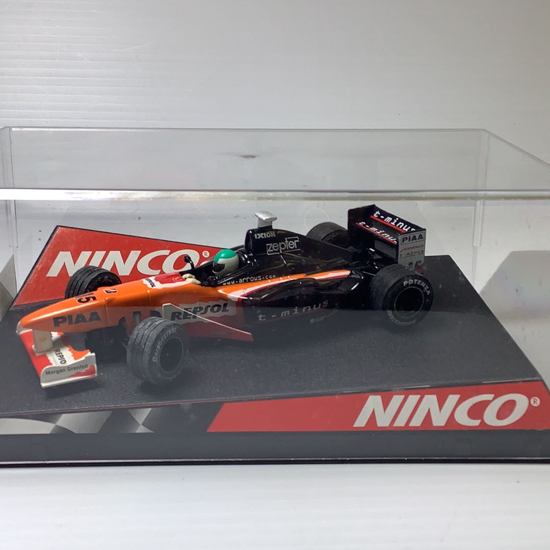 Orange and black race car toy, detailed model on a display base for Ninco 50212