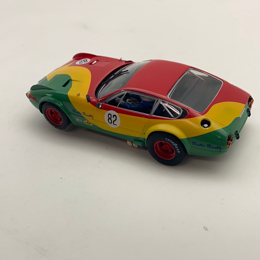 Slot car of a 1974 365 GTB/4 race car in green, red, and yellow for Fly Car 88190