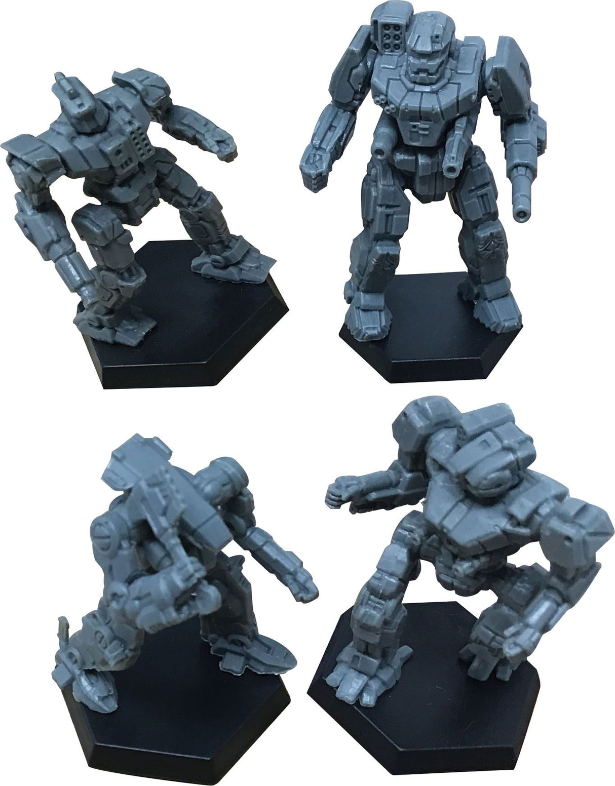 Three sci-fi mech miniatures posed on black bases for BattleTech 35727